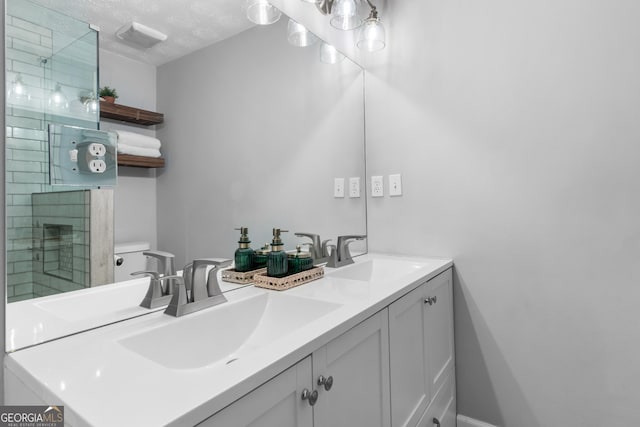 bathroom with vanity and an enclosed shower