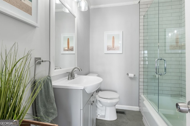 full bathroom with crown molding, shower / bath combination with glass door, tile patterned flooring, vanity, and toilet