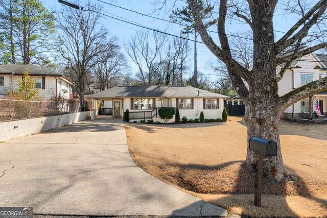 view of front facade with a carport and a porch