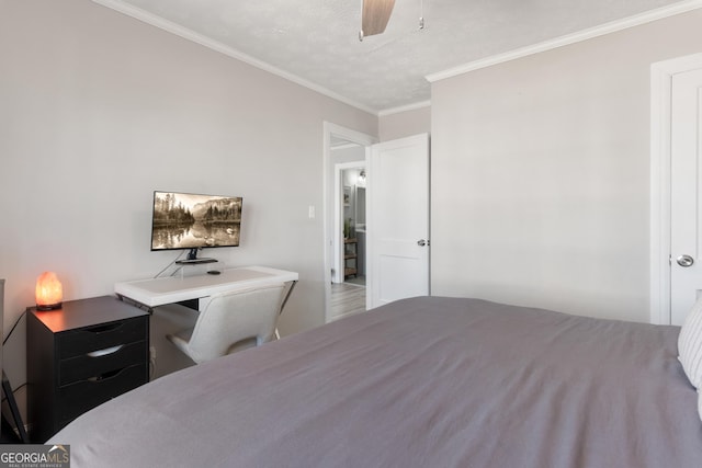 bedroom with ceiling fan, ornamental molding, and a textured ceiling