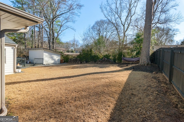 view of yard with a storage unit