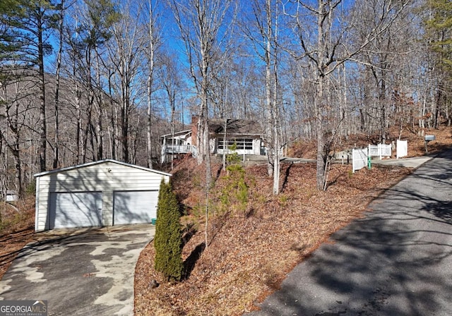 view of front facade featuring an outbuilding and a garage