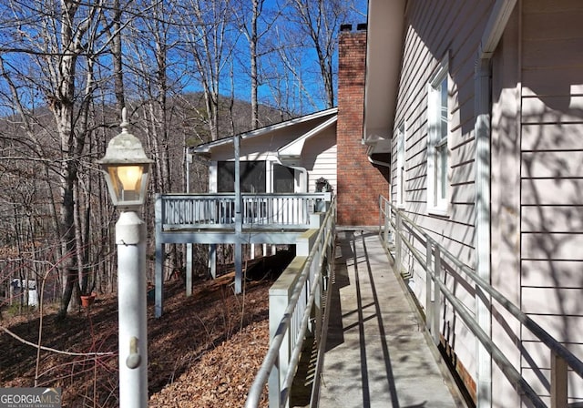 view of side of property with a deck