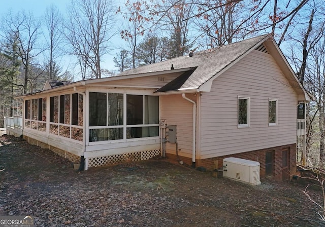 back of property featuring a sunroom