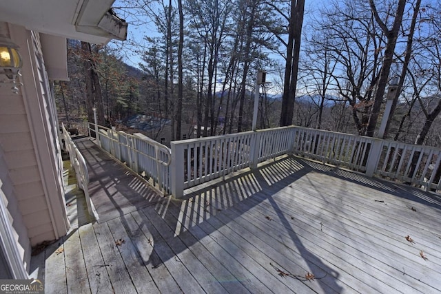 wooden terrace with a mountain view