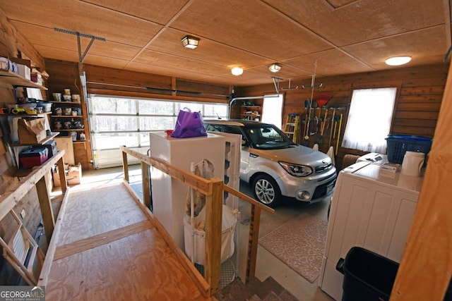 garage with washer and clothes dryer