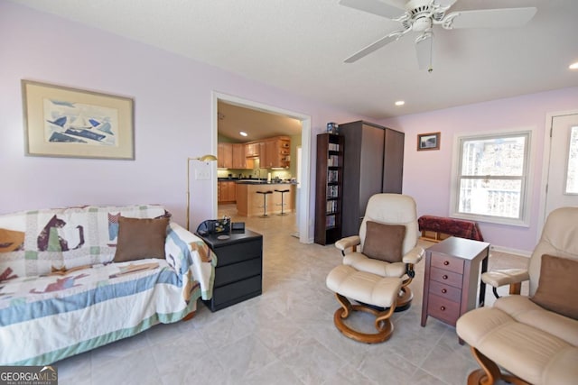 living room with ceiling fan