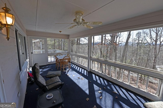 sunroom / solarium with ceiling fan