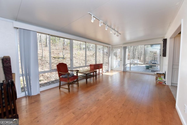 sunroom / solarium with track lighting