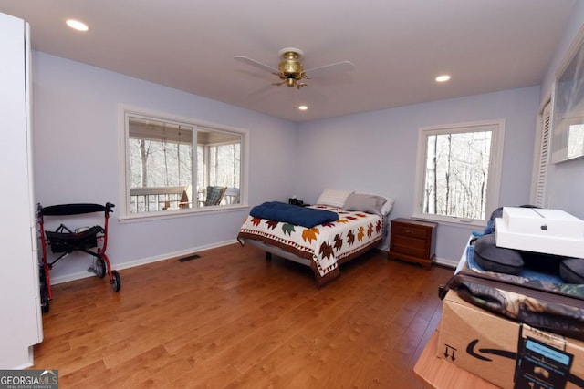 bedroom featuring hardwood / wood-style flooring and ceiling fan