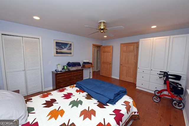 bedroom with ceiling fan and dark hardwood / wood-style flooring