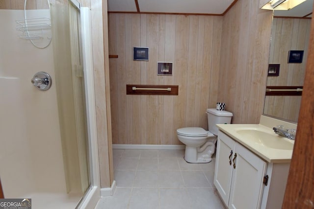 bathroom with vanity, tile patterned flooring, toilet, and walk in shower