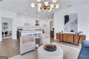 living room featuring a chandelier