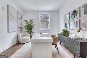 living area with wood-type flooring and a wealth of natural light