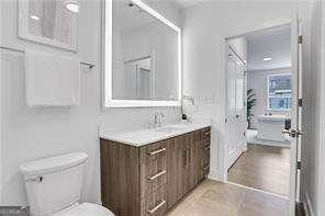 bathroom with vanity and toilet