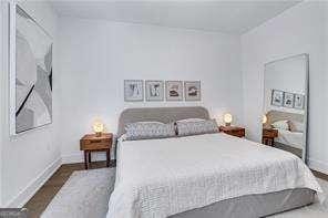 bedroom featuring dark hardwood / wood-style flooring