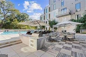 view of patio / terrace featuring a community pool