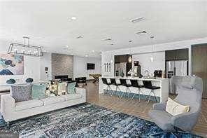 living room featuring hardwood / wood-style flooring and a fireplace