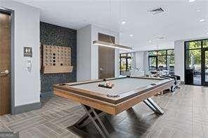 rec room with billiards and french doors