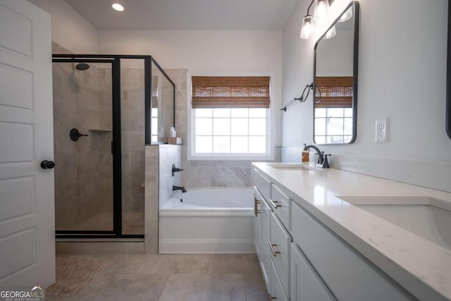 bathroom with vanity, separate shower and tub, tile patterned flooring, and a wealth of natural light