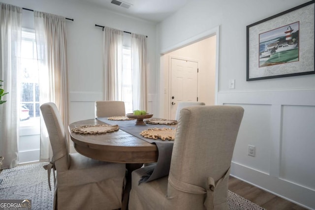 dining area with hardwood / wood-style floors