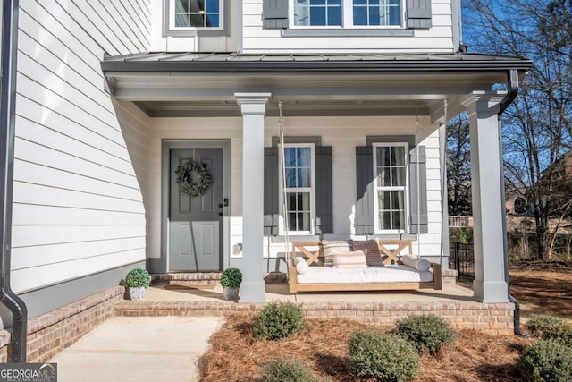 doorway to property featuring a porch