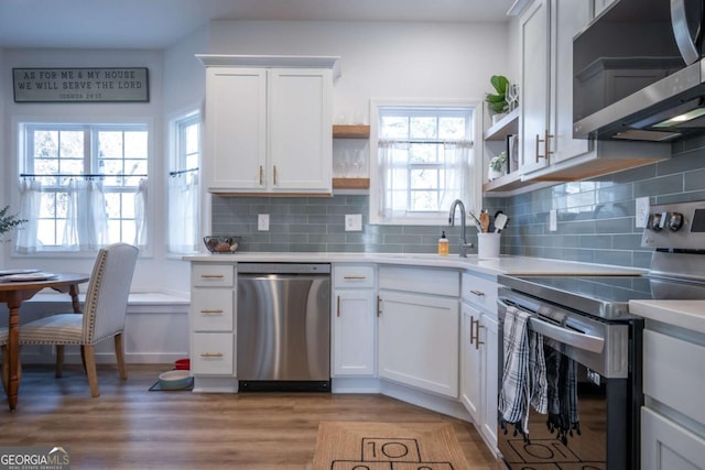 kitchen with white cabinetry, appliances with stainless steel finishes, and sink