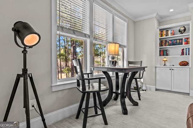 dining space with light carpet and crown molding