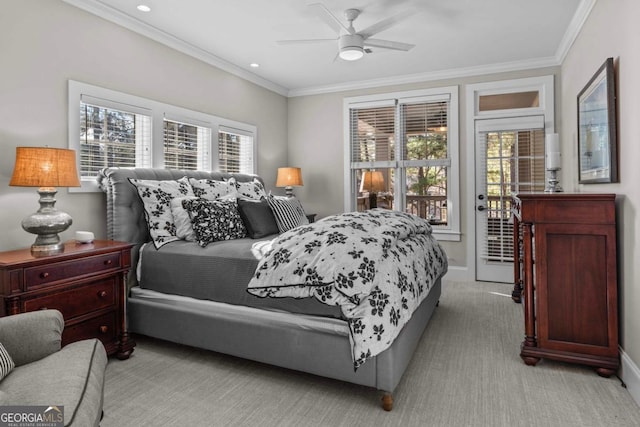 carpeted bedroom featuring ornamental molding and ceiling fan