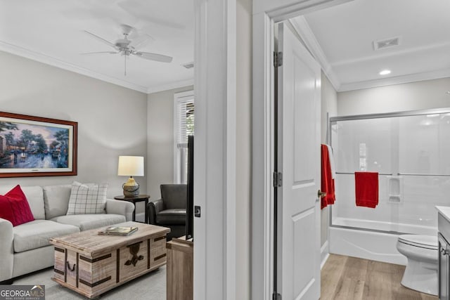 interior space with crown molding, ceiling fan, and light hardwood / wood-style floors