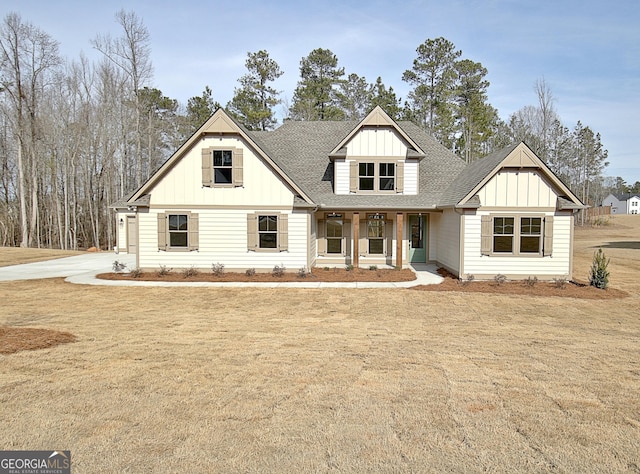 view of front of house with a porch and a front lawn