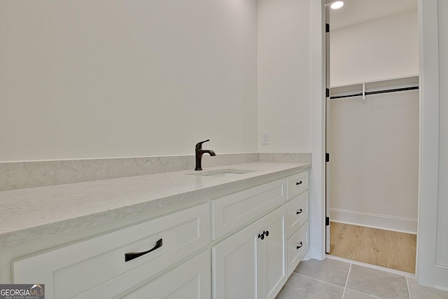 bathroom featuring vanity and tile patterned flooring