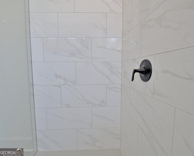 room details with a tile shower