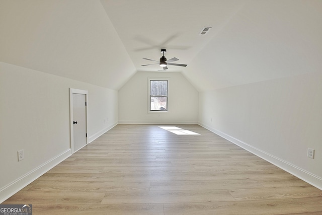 additional living space featuring vaulted ceiling, light hardwood / wood-style floors, and ceiling fan