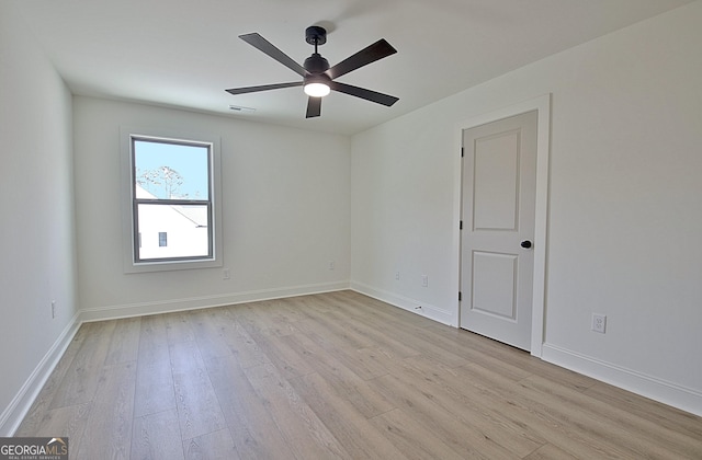 spare room with ceiling fan and light hardwood / wood-style floors