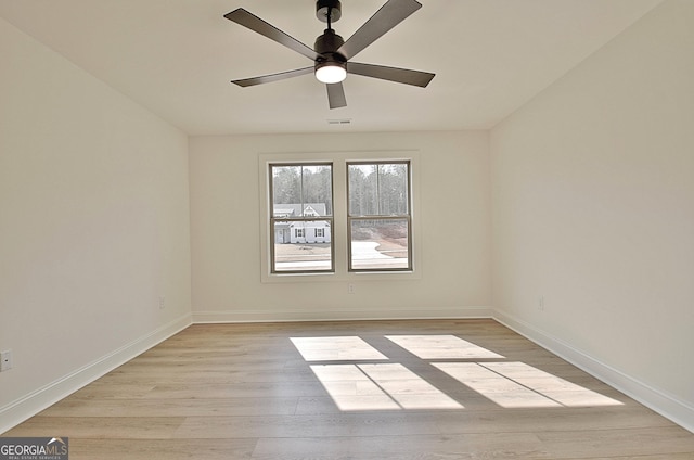 unfurnished room with light hardwood / wood-style flooring and ceiling fan