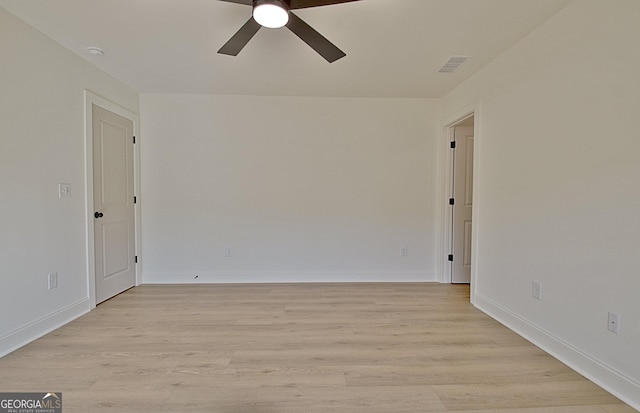 unfurnished room with ceiling fan and light hardwood / wood-style floors