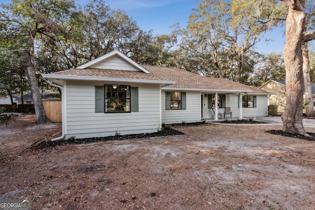 ranch-style home featuring a porch