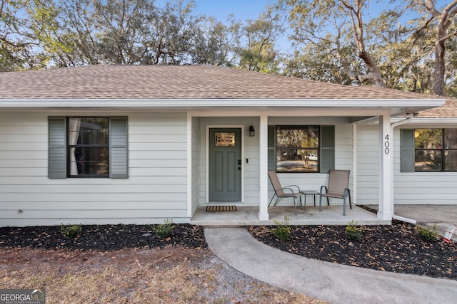 doorway to property featuring a porch