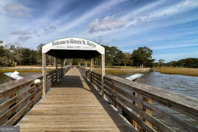 view of dock with a gazebo and a water view