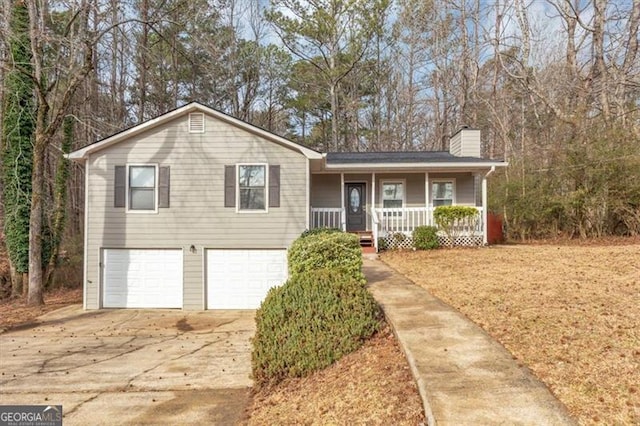 view of front of property with a garage and covered porch