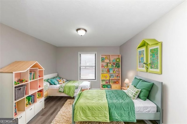 bedroom featuring dark hardwood / wood-style floors