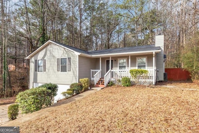 ranch-style house with a porch and cooling unit