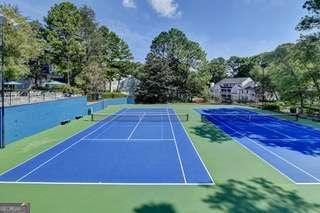 view of sport court featuring basketball hoop