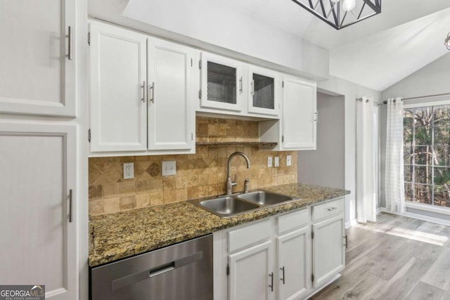 kitchen featuring white cabinetry, dishwasher, and sink