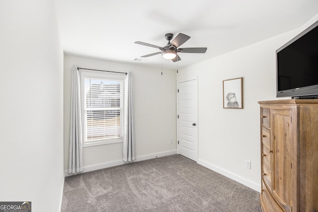 unfurnished bedroom with ceiling fan and light carpet