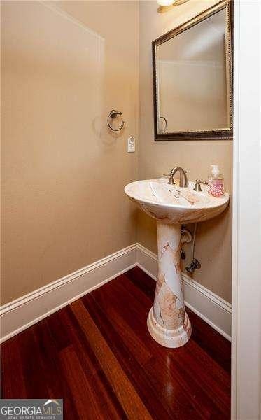 bathroom with wood-type flooring