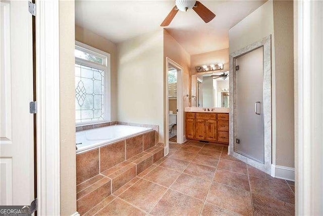 bathroom with ceiling fan, vanity, independent shower and bath, and tile patterned flooring