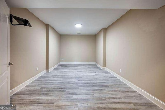 spare room featuring light wood-type flooring