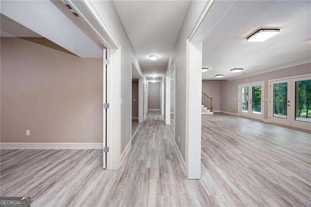 corridor featuring light hardwood / wood-style floors